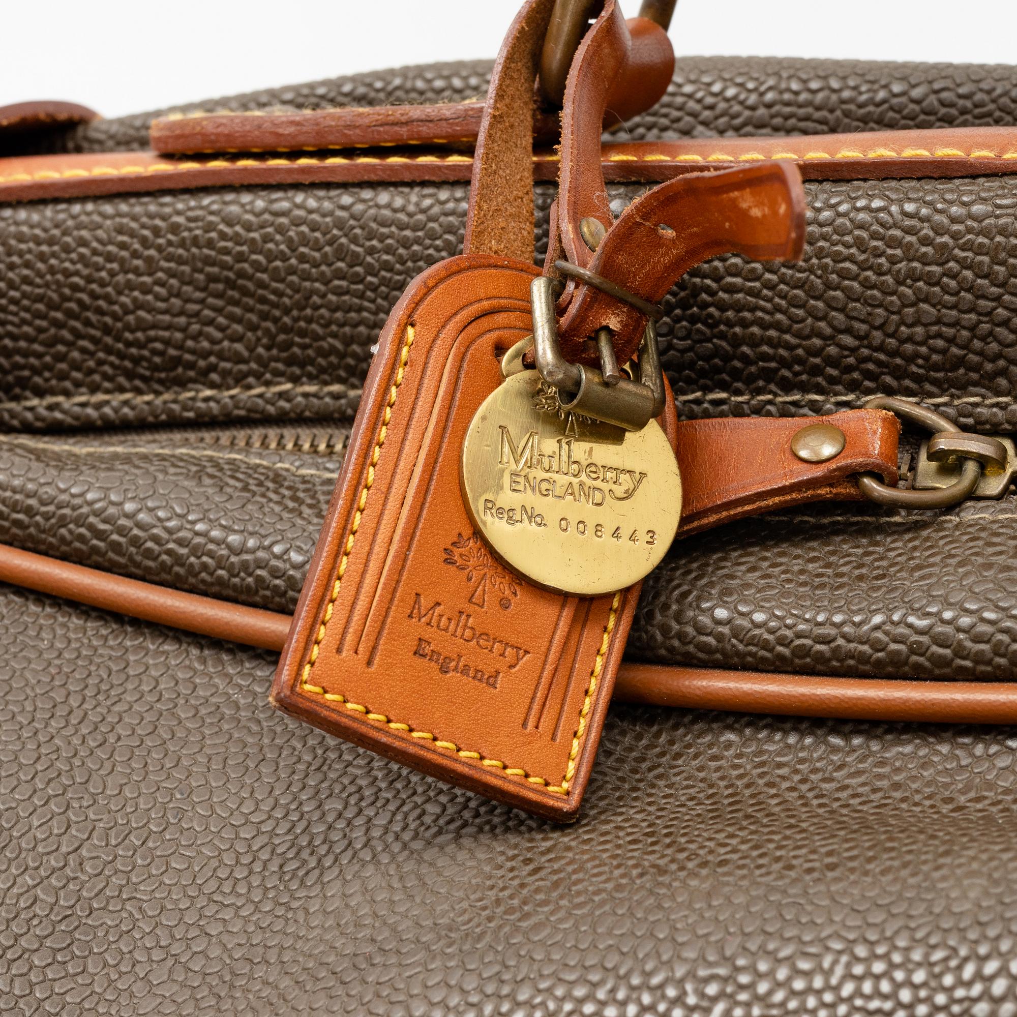 Mulberry, a scotch grain suitcase.