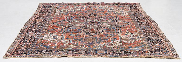 An antique Heriz carpet, west Persia, c. 333 x 238 cm.
