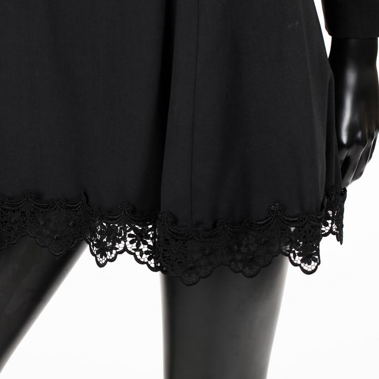 VERSACE, a black dress with lace.