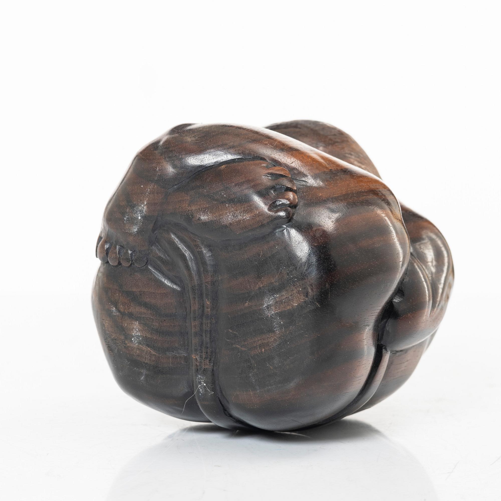 A portable buddhist altar and a figure of 'Weeping Buddha', Japan and Indonesia.