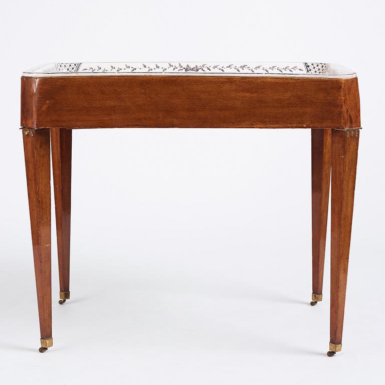 A Gustavian mahogany and faience tea table, late 18th century.