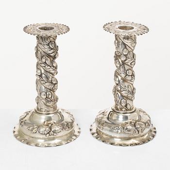 A pair of Baroque-style silver candle sticks, with Swedish import marks, first half of the 20th century.