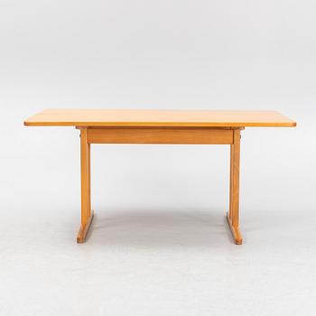A beech dining table, second half of the 20th Century.