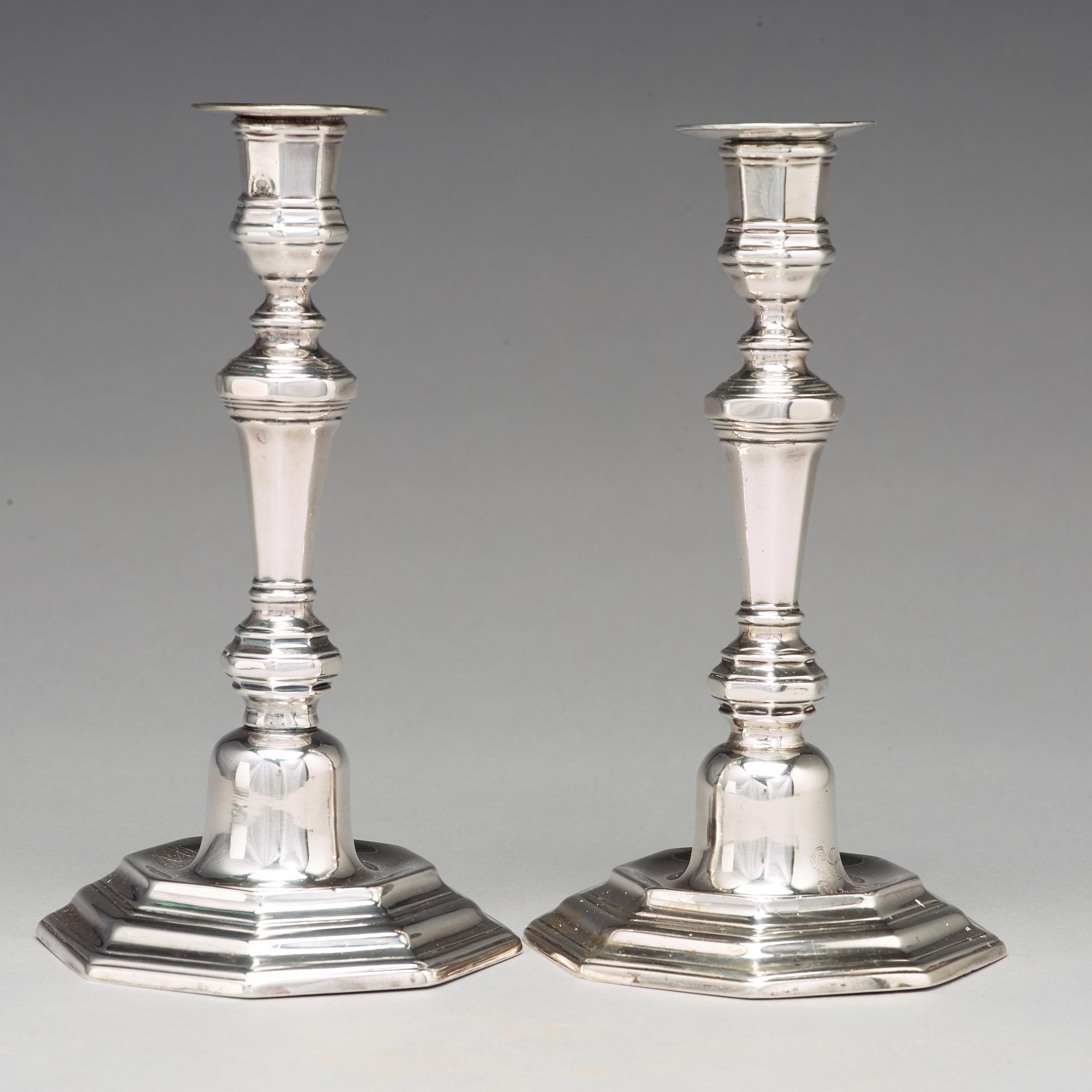 A pair of European 18th century silver candlesticks, unidentified makers mark.