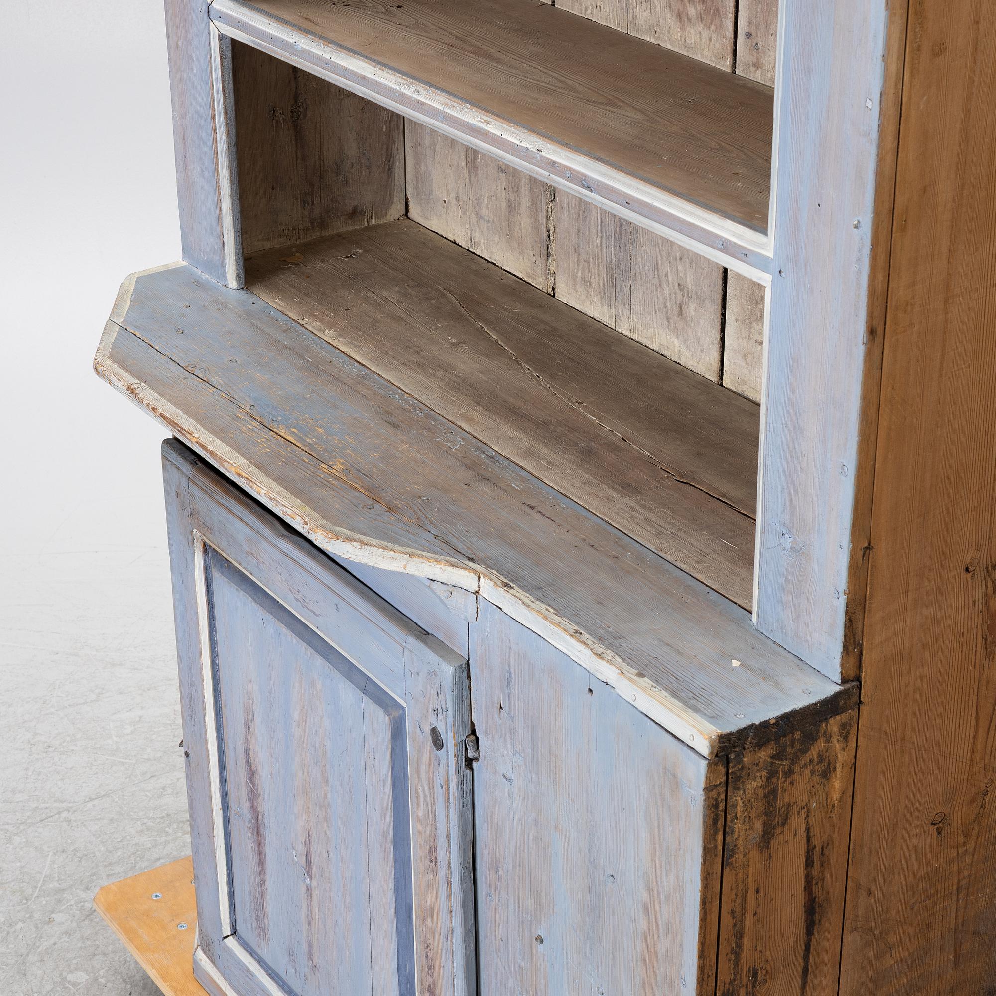 A painted folk-art cupboard, early 19th century.