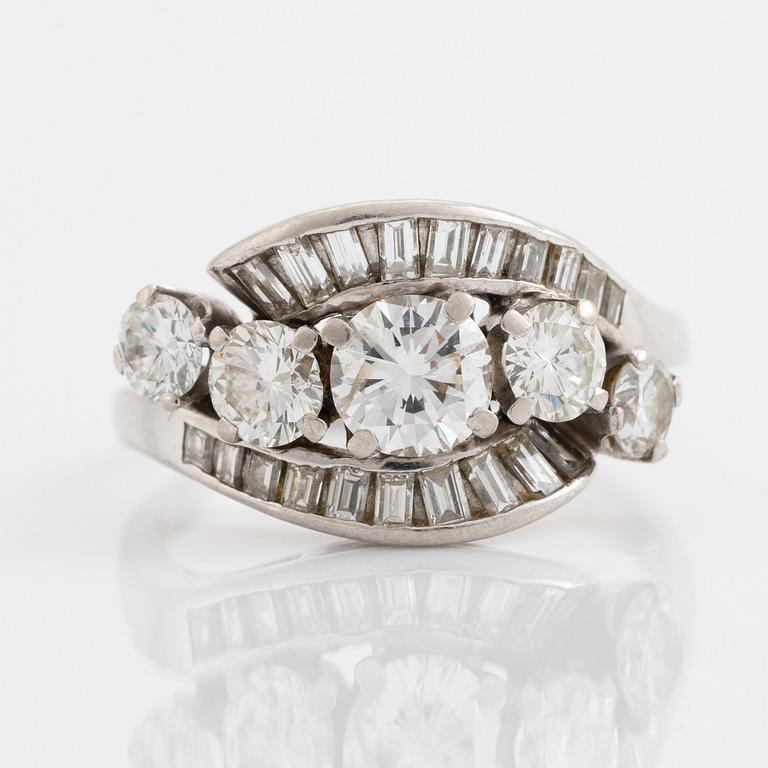 Platinum, brilliant and baguette cut diamond ring.