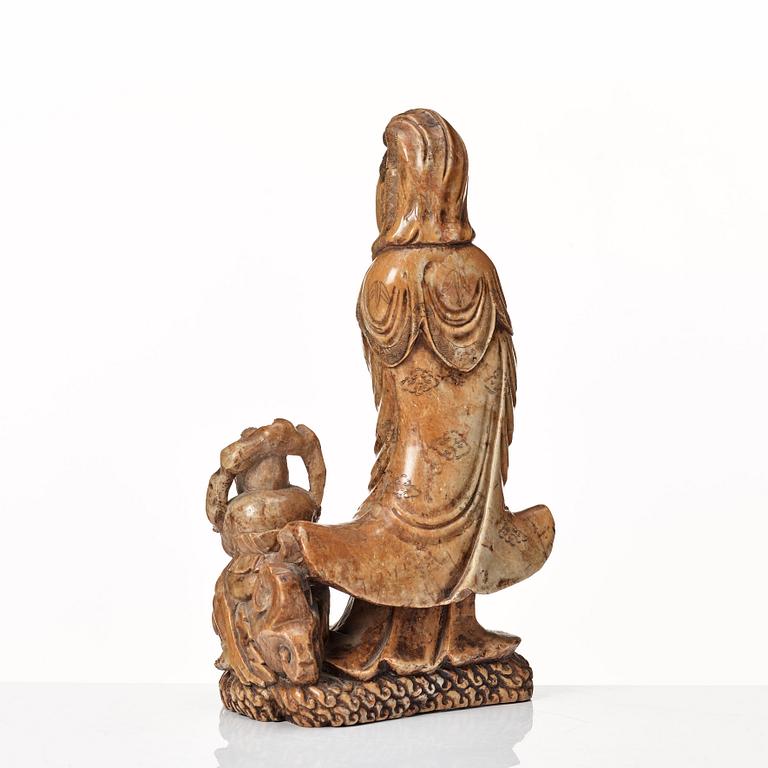 A soapstone sculpture of Guanyin with an attendant, Qing dynasty.