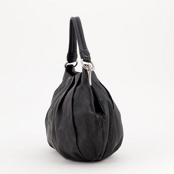 PRADA, a black leather shoulder bag.