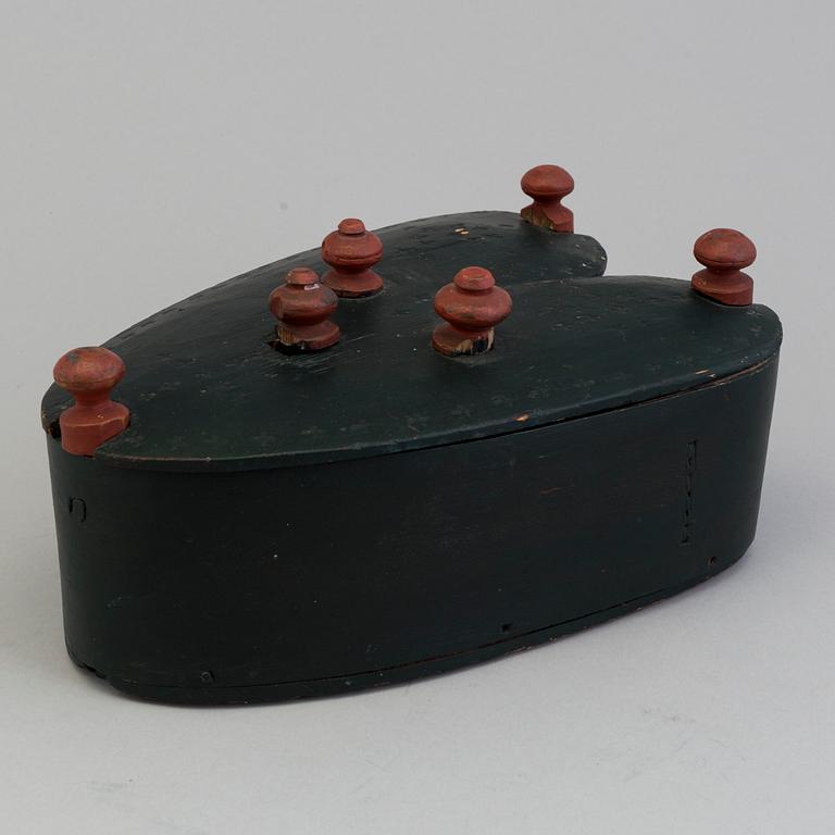 A 19th century folks wooden box in the shape of a loveheart, signed ANS.