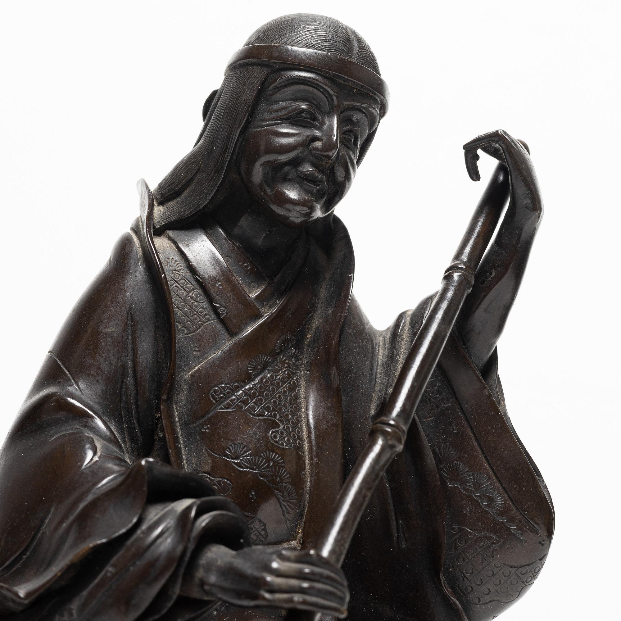 A Japanese bronze sculpture, of a gardener, Meiji period (1868-1912).