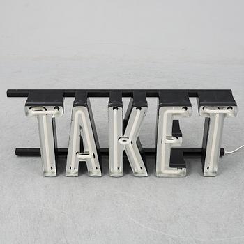 A neon sign "TAKET", late 20th century/21st century.
