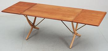 A Hans J Wegner teak and beech dinner table by Andreas Tuck, Denmark.