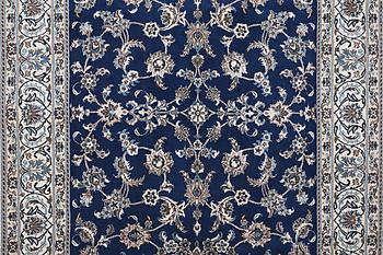 A carpet, Nain, part silk, ca 297 x 194 cm.