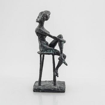 Inga Bagge, A seated woman.