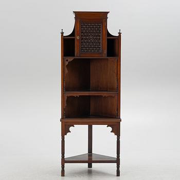 A corner cabinet, Liberty & Co, England, circa 1900.