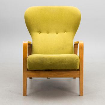 A 1960s 'Puck' armchair for Keravan Puusepäntehdas, Stockmann, Finland.