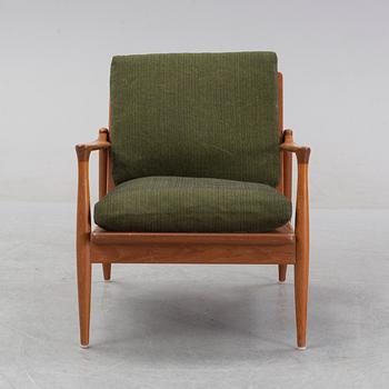 A 1950's/60's teak and oak easy chair.
