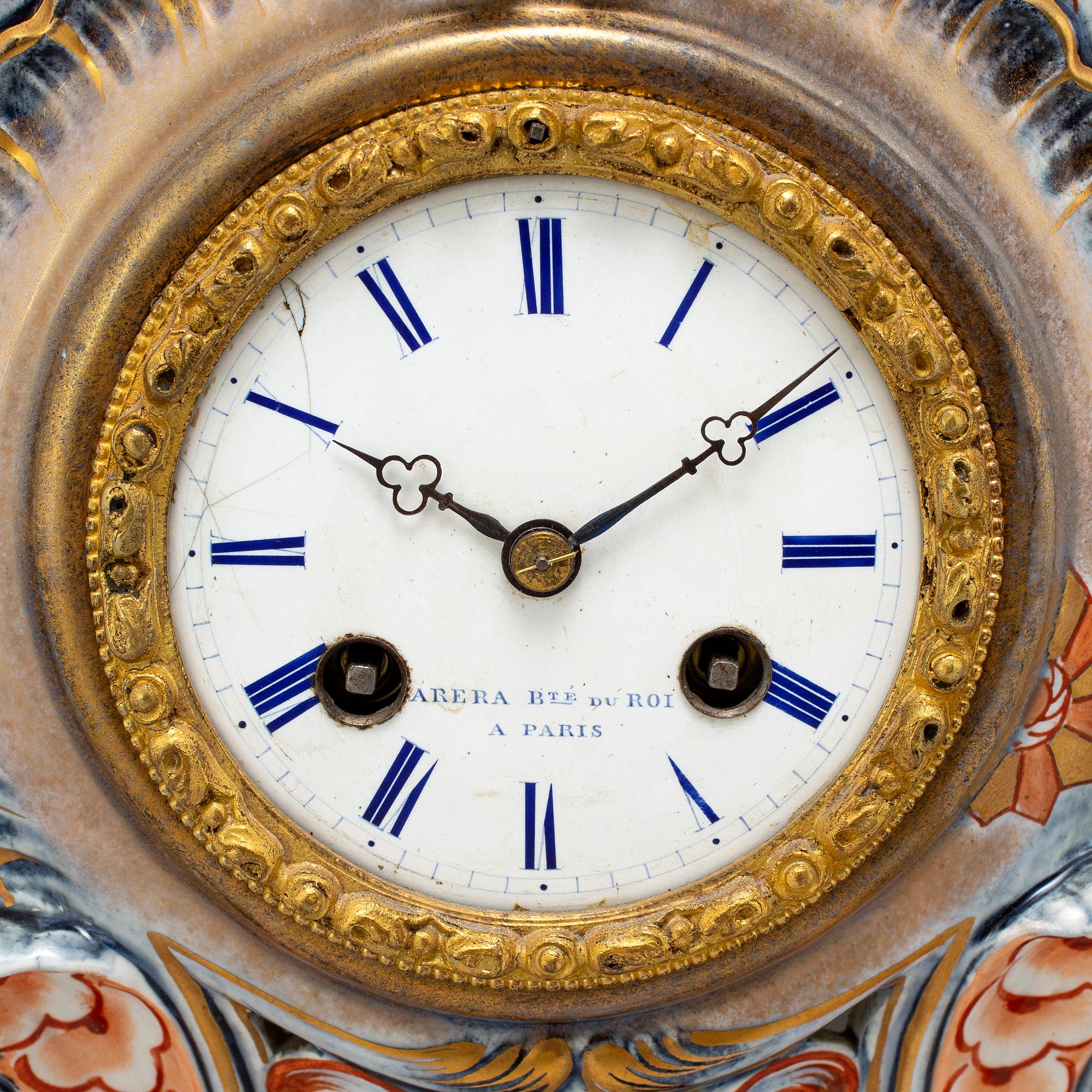 A new rococo creamware bracket clock, after Meissen model, early 20th century.