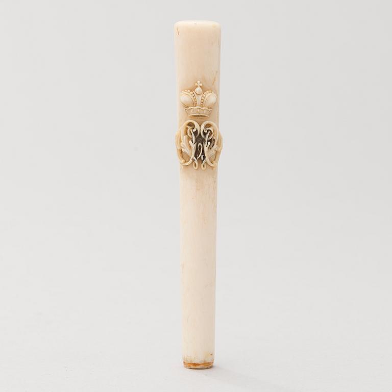 A Russian carved bone pen handle.