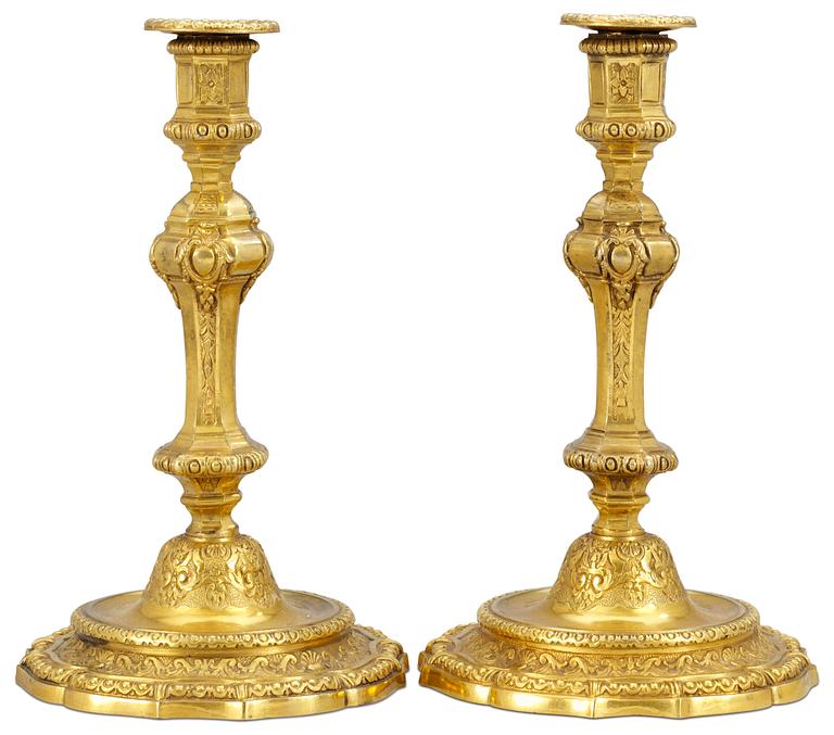 A pair of gilded bronze candlesticks by H. Picard, Paris 19th century.