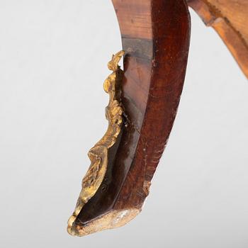 A Swedish rosewood-veneered Rococo chest of drawers, later part of the 18th century.