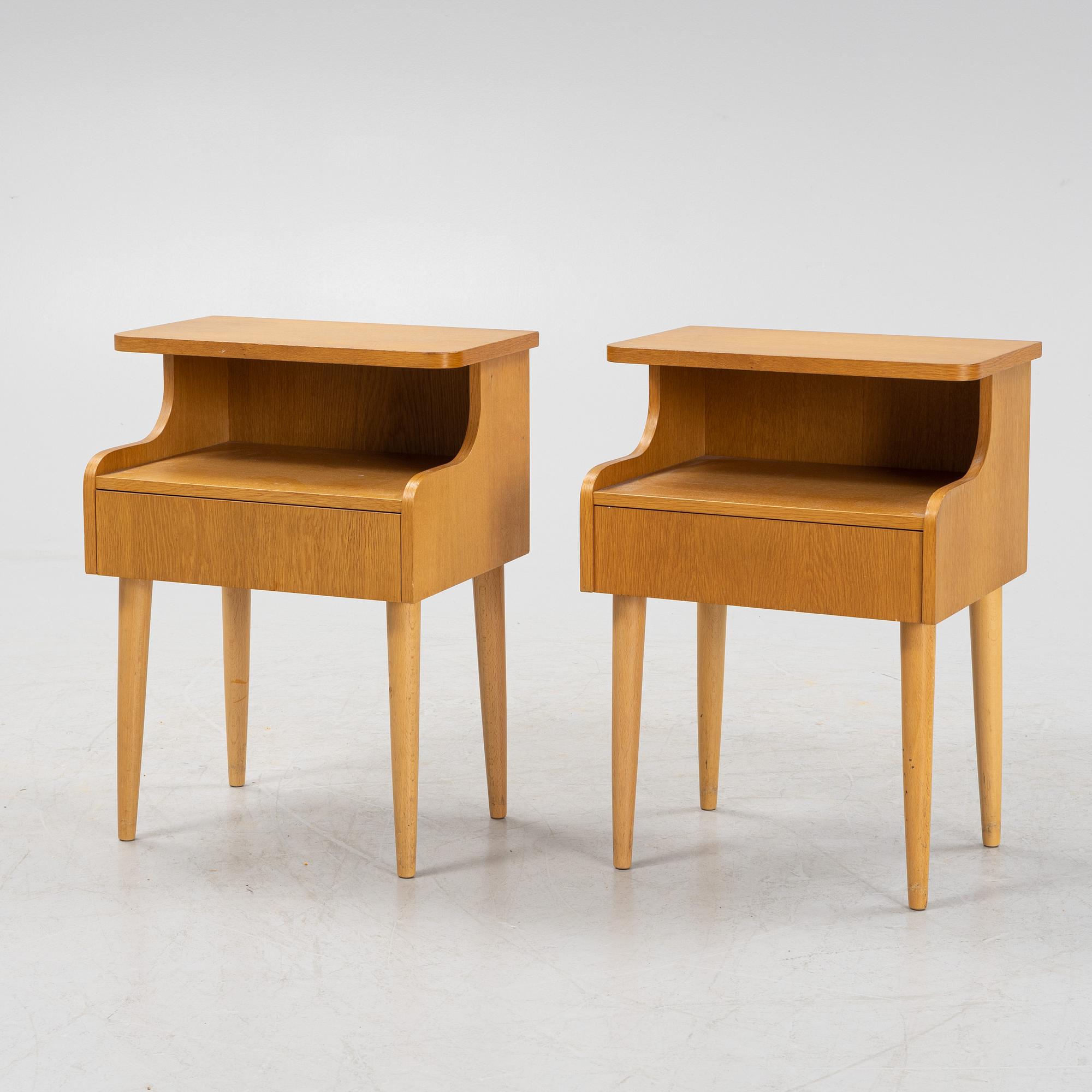 A pair of oak veneered bedside tables, mid 20th Century.