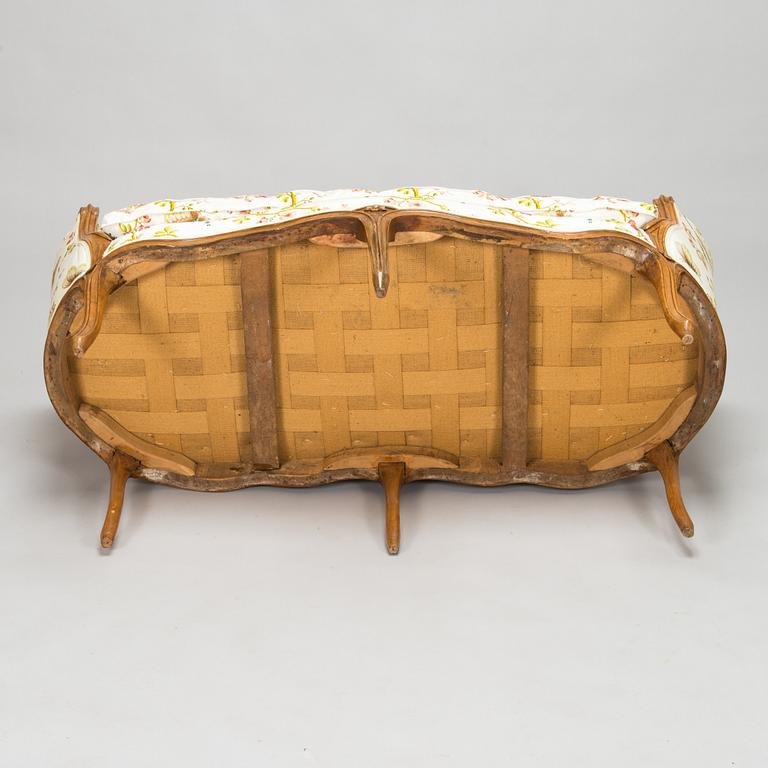 A French, mid-18th-century Louis XV sofa.