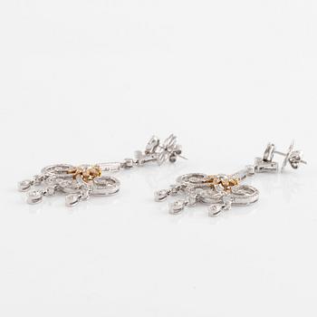 A pair of 18K white gold and round brilliant cut diamond chandelier earrings.