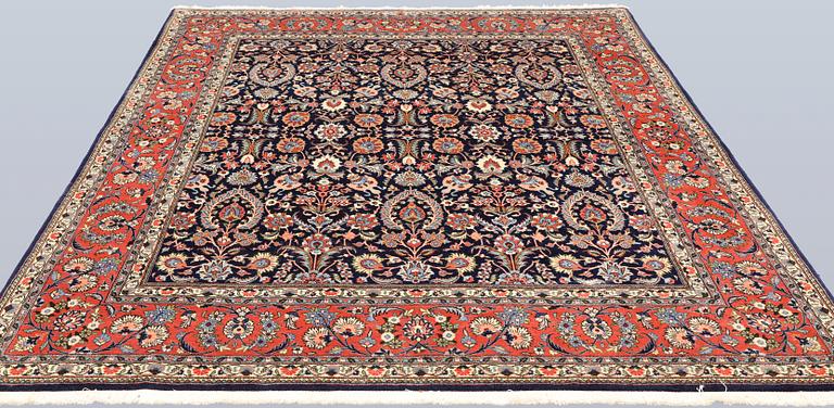 A part silk Sarouk rug, signed, approx. 240 x 208 cm.