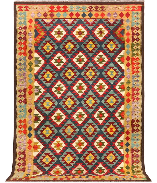 An Afghan Kelim carpet, c. 304 x 200 cm.
