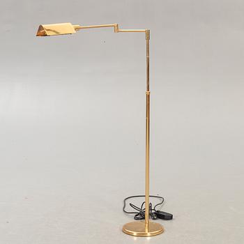 A brass floor lamp later part of the 20th century.