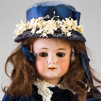 A bisque head doll, Germany, 1910s.