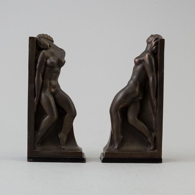 A pair of circa 1920 bronze book ends by Axel Gute, signed.