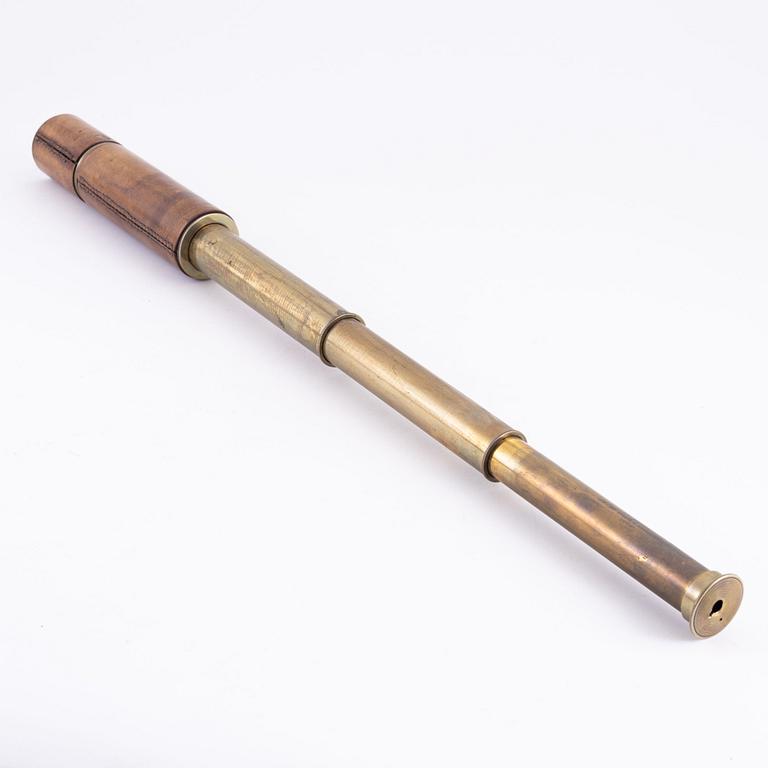 A brass spotting scope from I. H. Steward, London, circa 1900.