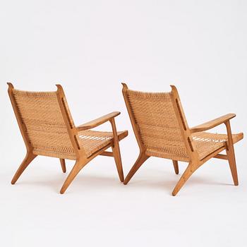 Hans J. Wegner, a pair of oak and rattan 'CH27' chairs, Carl Hansen & Søn, Odense Denmark 1950s-1960s.