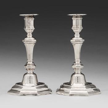 A pair of French 18th century silver candlesticks, unidentified makers mark.