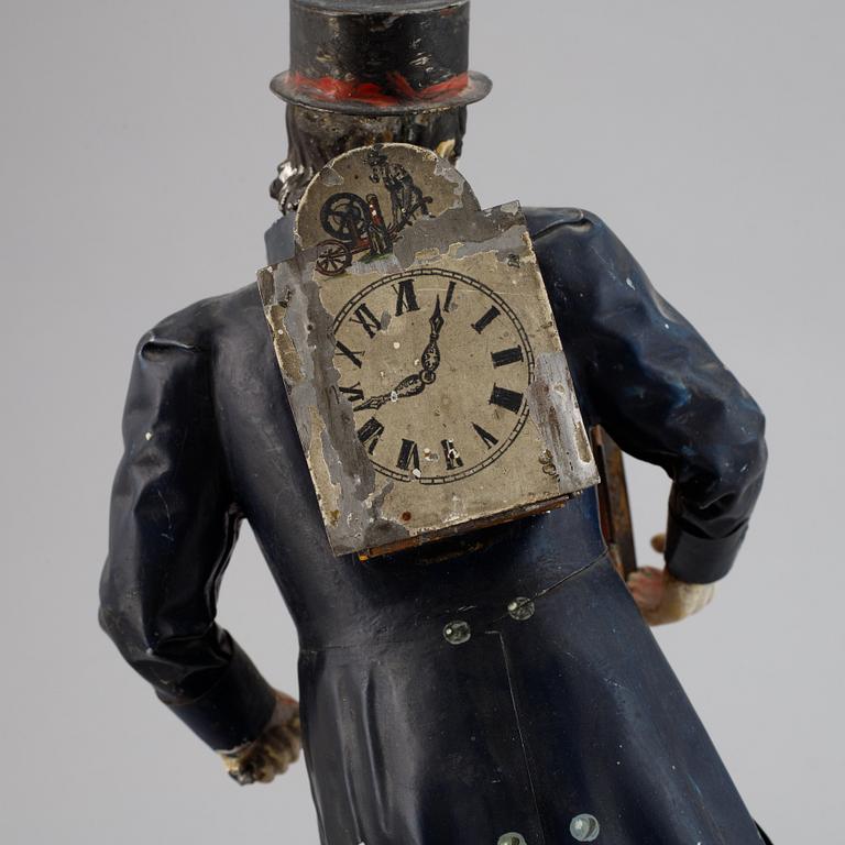 A Black Forest sheet metal figural timepiece, second half of the 19th century.