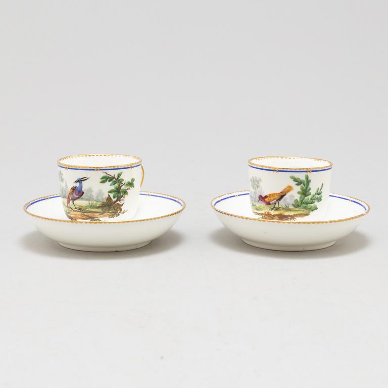 A pair of cups and saucers, "Sévrès"like mark, 19th century.