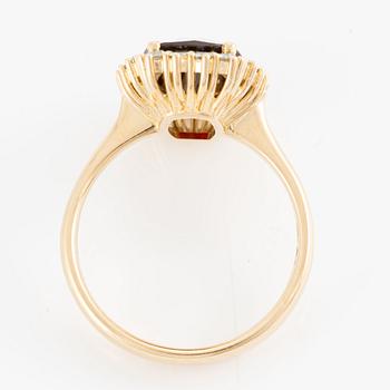 Ring with checkerboard-cut garnet and octagon-cut diamonds.