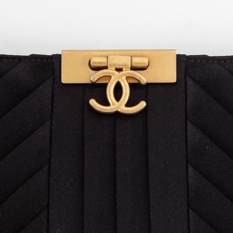 Chanel, a black satin clutch, 2019.