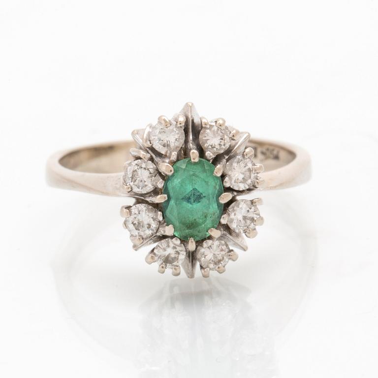 Ring in 18K white gold with an oval faceted green tourmaline and round brilliant-cut diamonds.