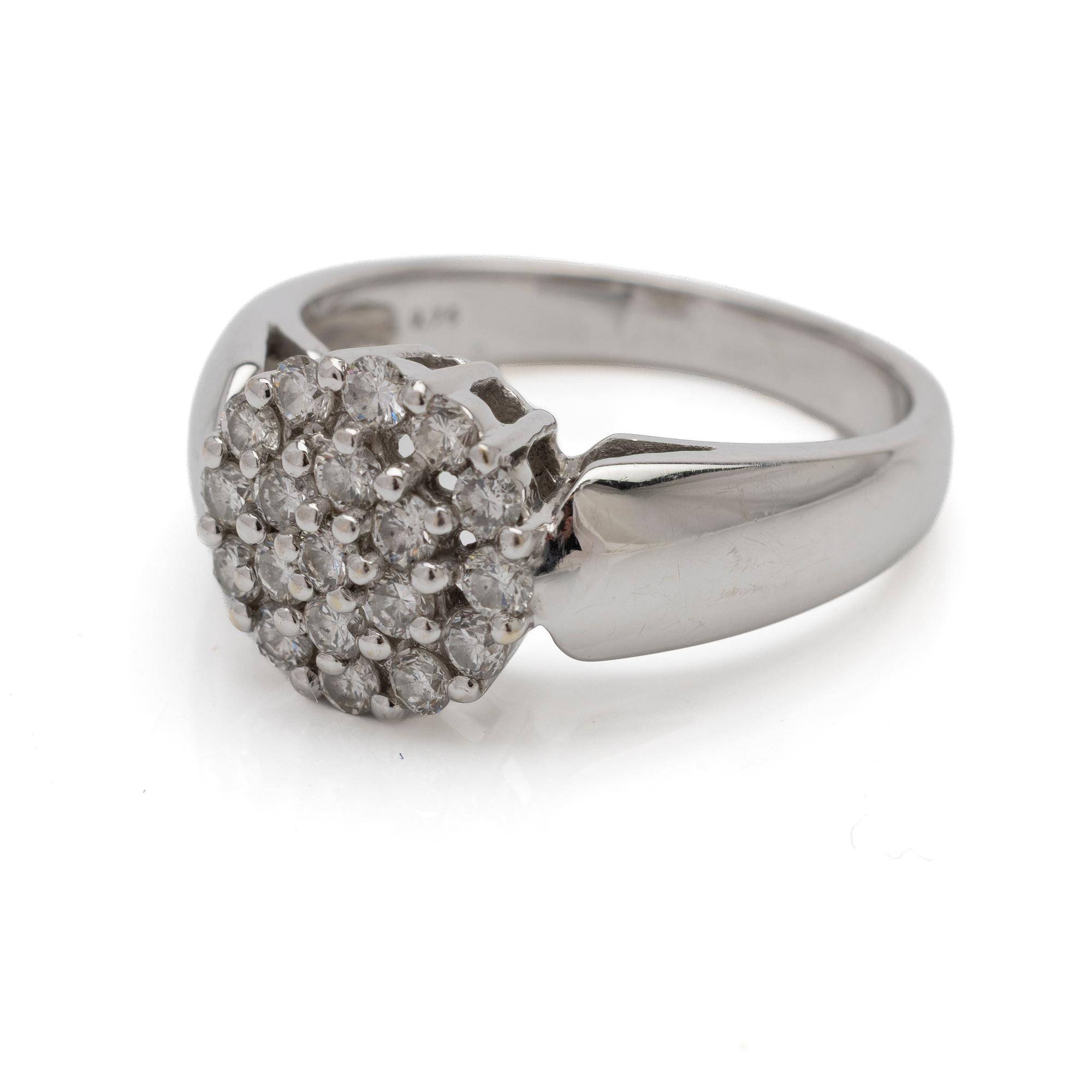 18K white gold ring with diamonds.