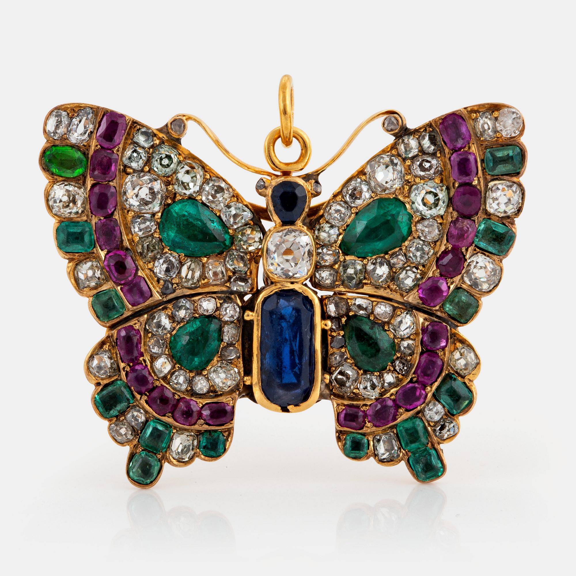 A butterfly brooch/pendant in 14K gold set with old-cut diamonds.