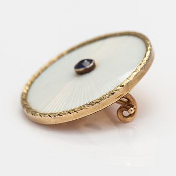 An 14K gold brooch with a synthetic sapphire and  enamel. St. Petersburg, early 20th century.