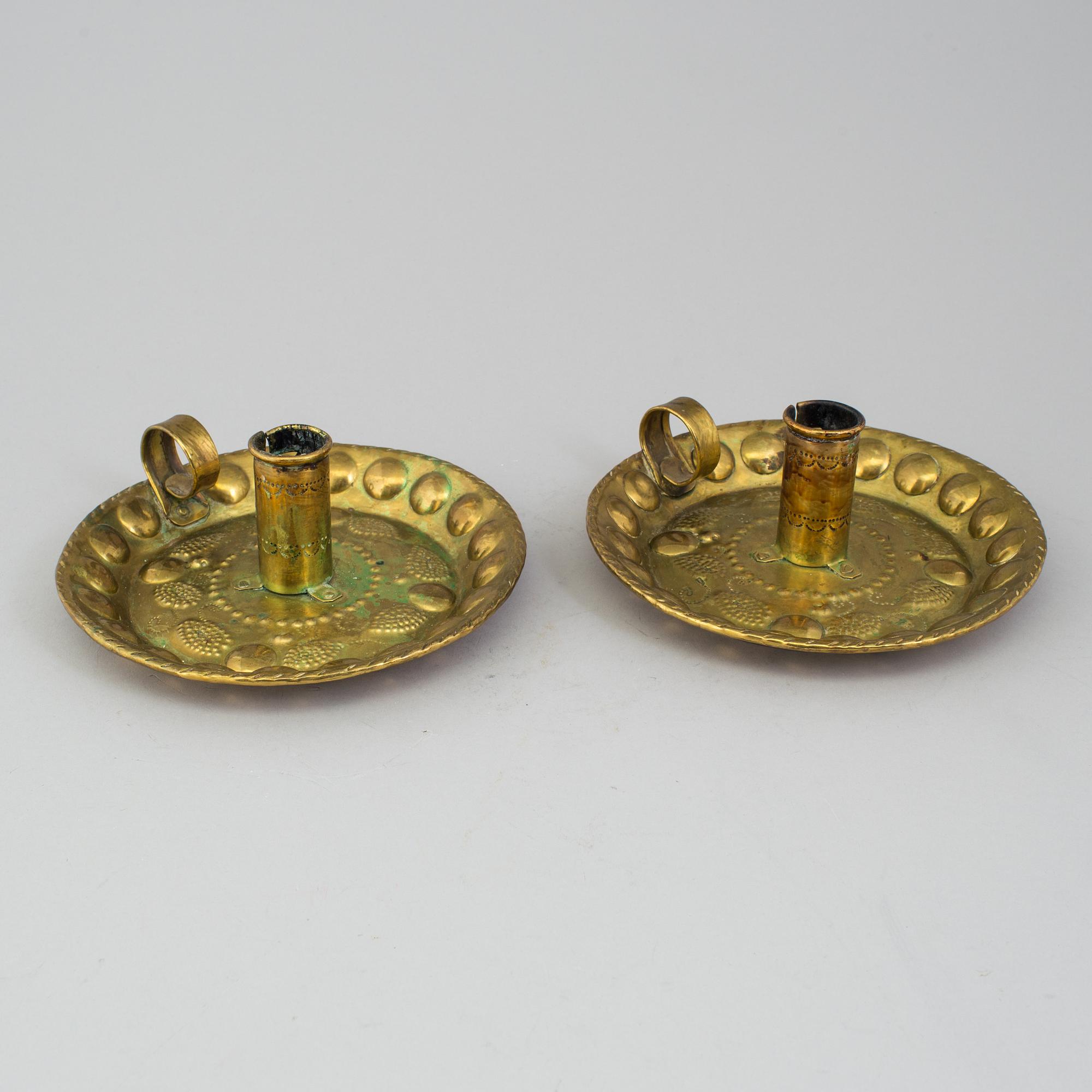 A pair of brass baroque style candlesticks.