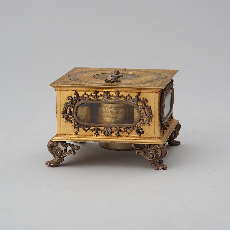 A Baroque 17th century traweller's clock in original case.