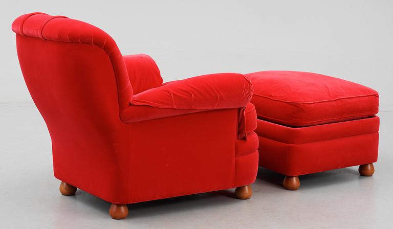 A Josef Frank armchair with ottoman by Svenskt Tenn model 336.