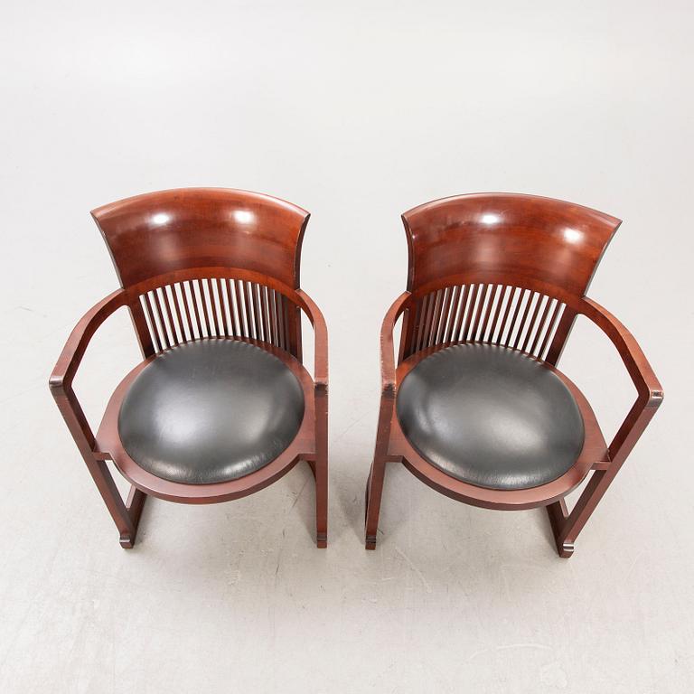 A pair of "606 Barrel Taliesin" armchairs by Frank Lloyd Wright for Cassina 1989, signed and numbered 28459, 28581.