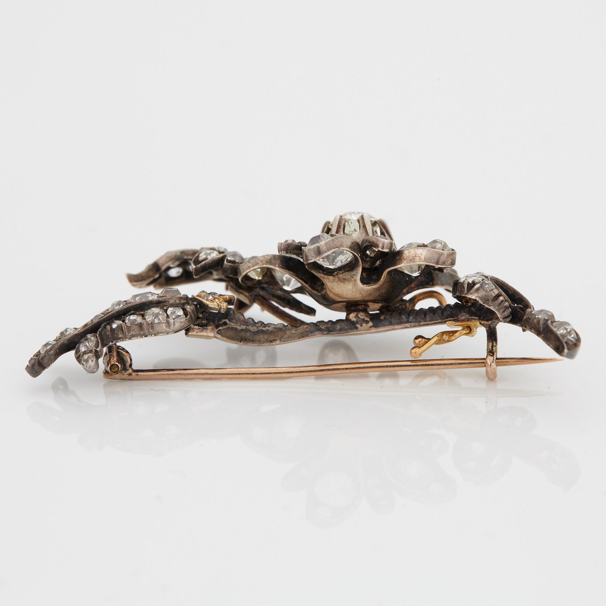 A BROOCH set with old-cut diamonds.