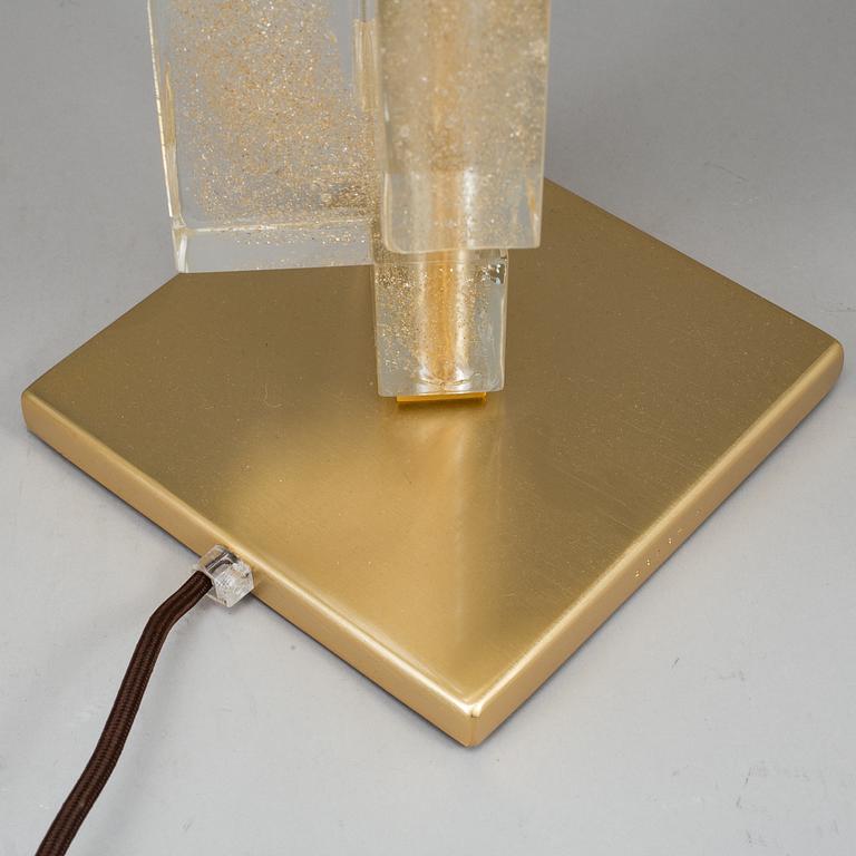 A 'Esha Alta' glass and brass table lamp from Donghia lightning.